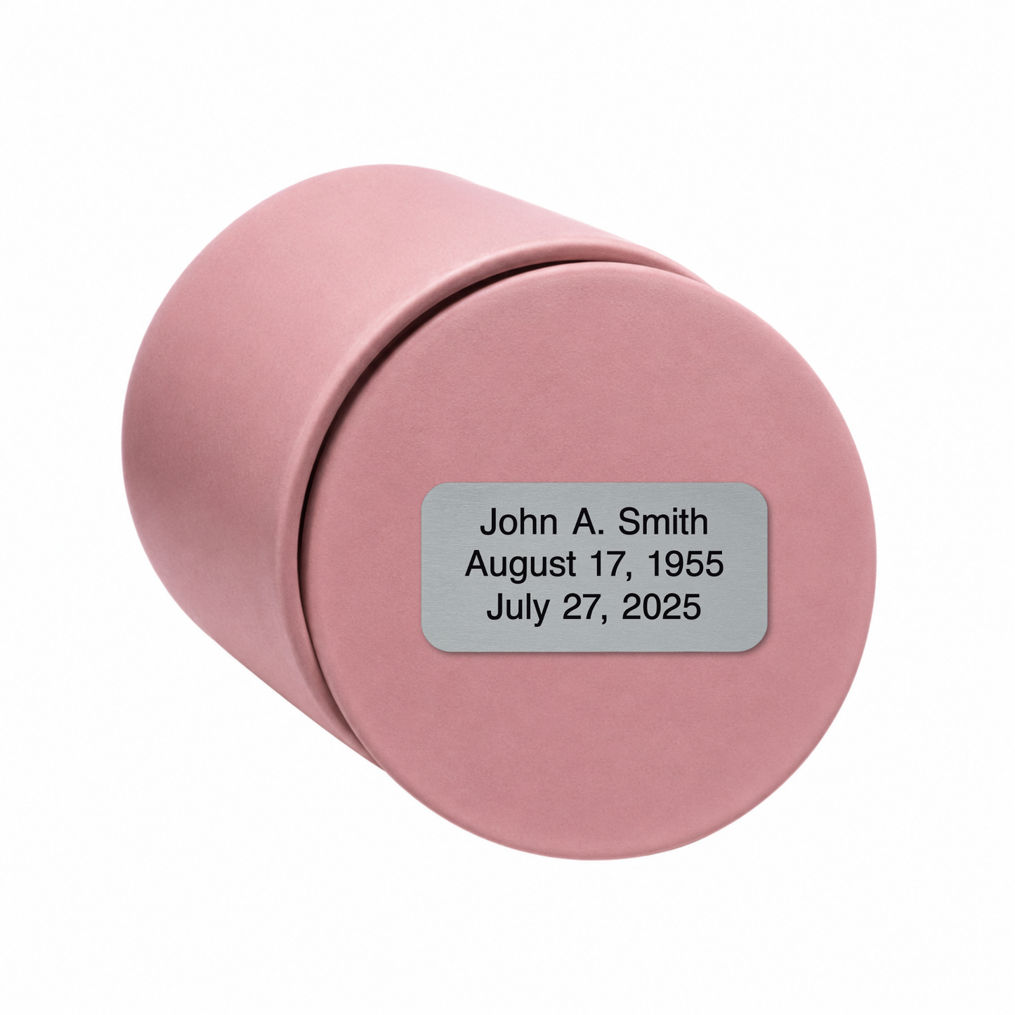 Blush Pink ceramic keepsake urn shown on its side with optional personalized memorial engraving plate