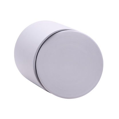 Gray ceramic keepsake urn shown on its side highlighting the smooth matte finish and secure lid