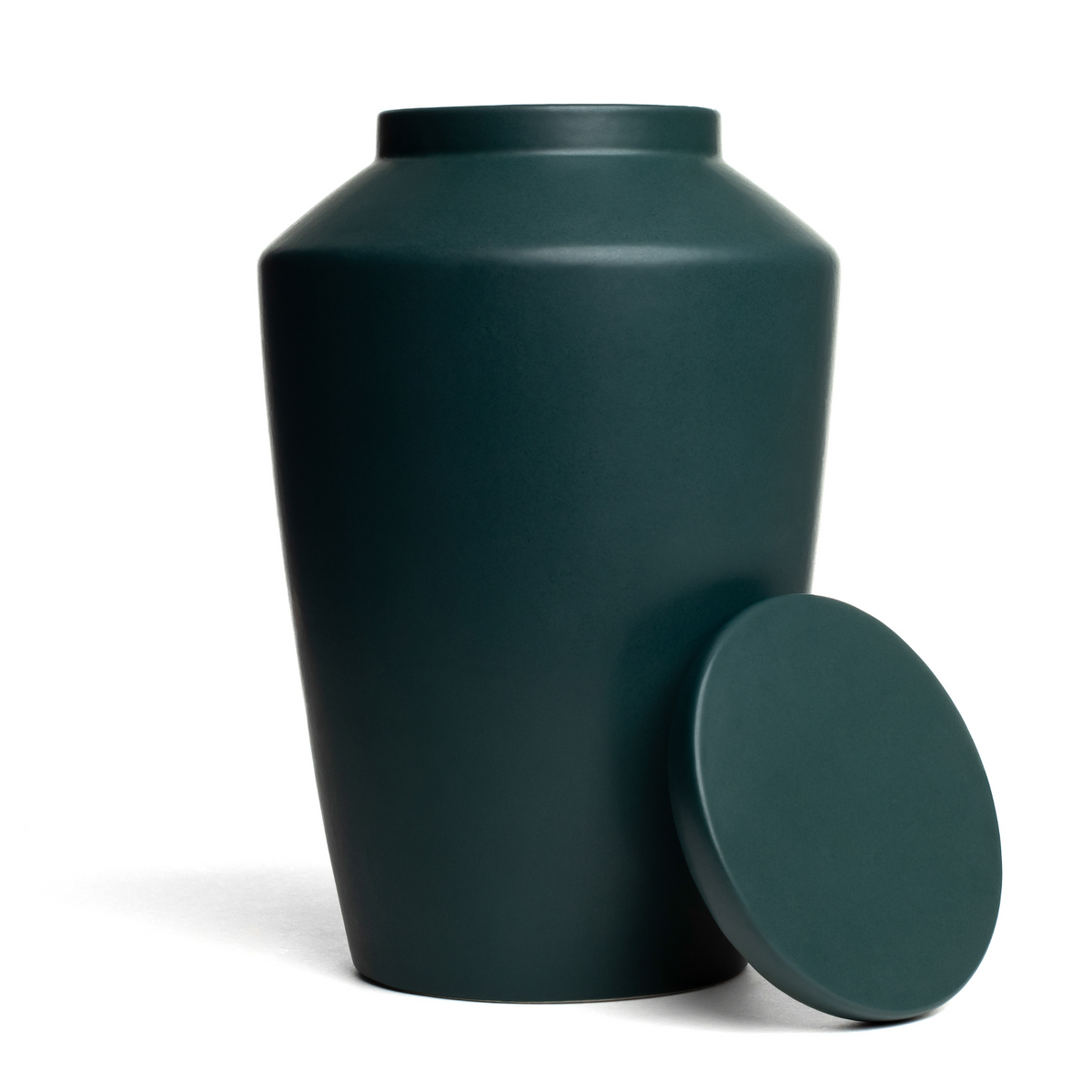View of a green keepsake ceramic urn with lid removed.