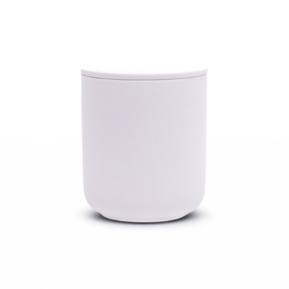White ceramic keepsake cremation urn, small handcrafted memorial for a portion of ashes, minimalist style.